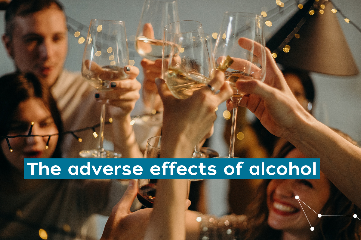 Four friends holding wine glasses "cheering" at a celebration with the words "The adverse effects of alcohol" written in white font